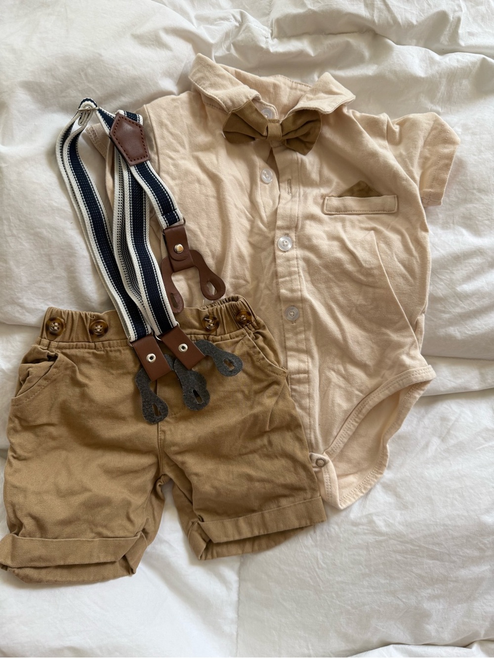 Beige Bowtie Onesie with Khaki Shorts and Navy Striped Suspenders baby